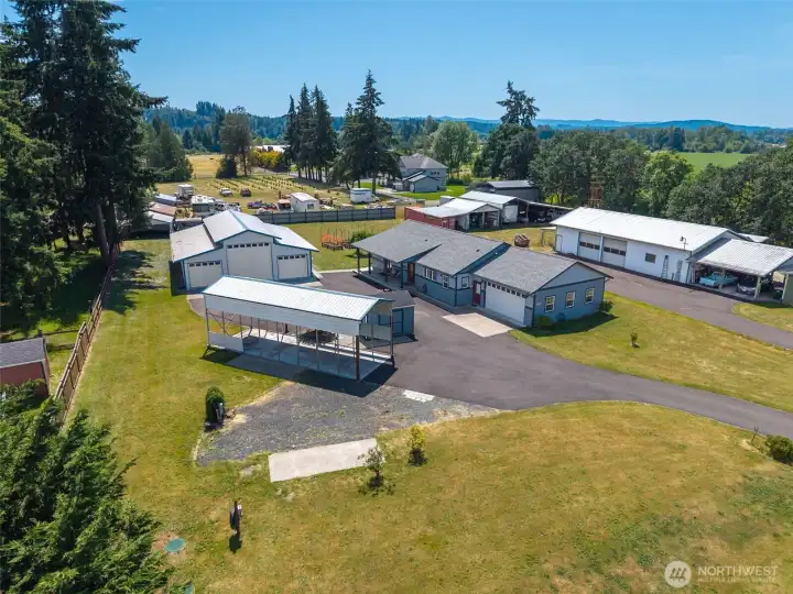 RV Spots, Well House, 1,920 sf shop and custom-built 1-story home on a flat 1-acre lot!