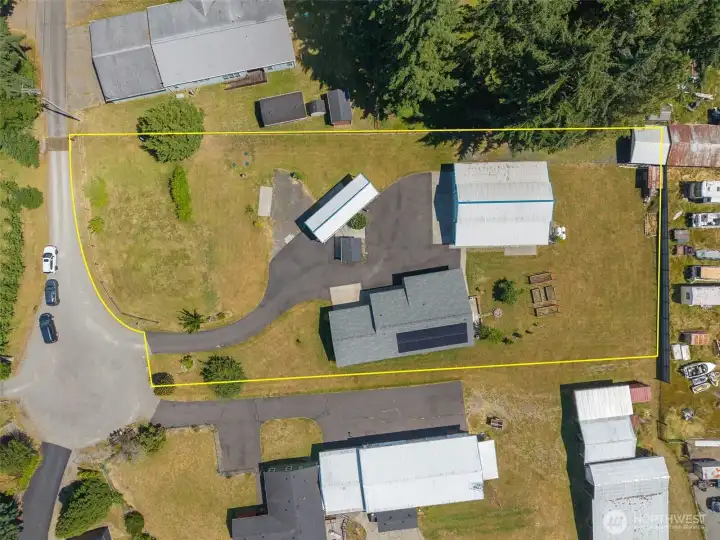 RV Spots, Well House, 1,920 sf shop and custom-built 1-story home on a flat 1-acre lot!