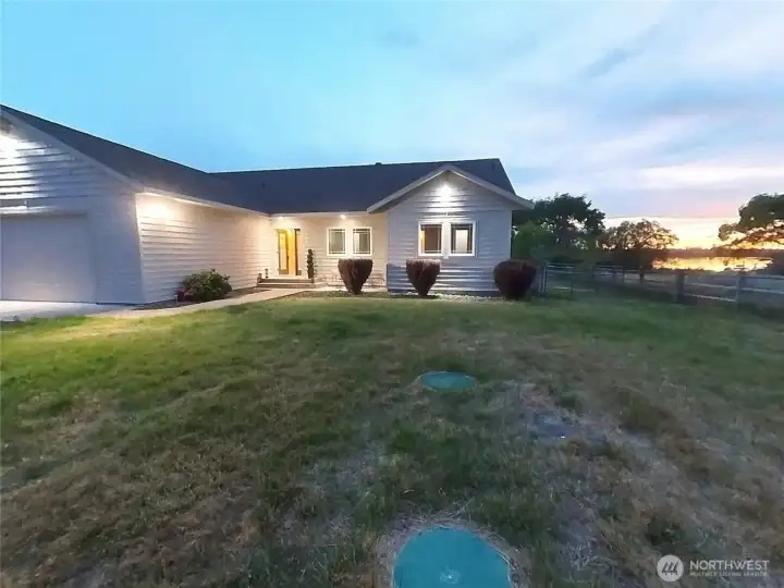 Front of home at night. Sunset in the back.