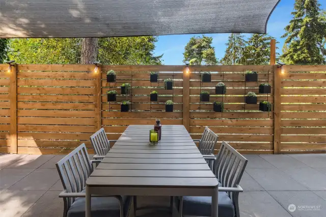 The recently enlarged custom paver patio provides an abundance of outdoor entertaining space options.