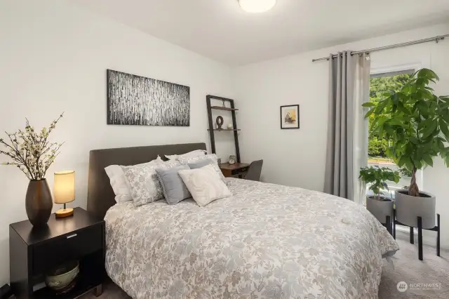 2nd bedroom with floor to ceiling windows.