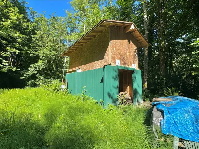 Unfinished outbuilding.