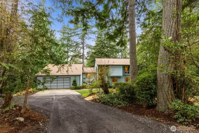 Follow the winding paved road that leads to a peaceful 2.33 acre property.