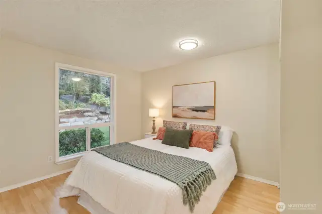 Two additional lower level bedrooms share a full bath.