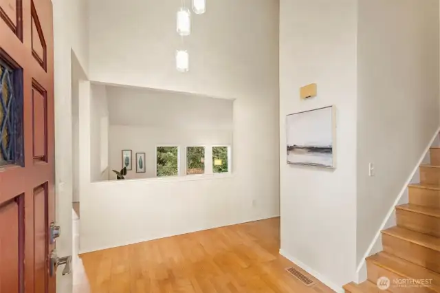 Enter to soaring vaulted ceilings, with oversized windows overlooking the serene property.