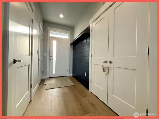 1/2 bathroom, laundry and utility closets are located at the entry hallway.