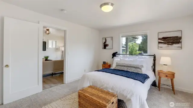 Cozy primary bedroom conveniently located just off the front entrance—offering a private retreat with easy access to the rest of the home