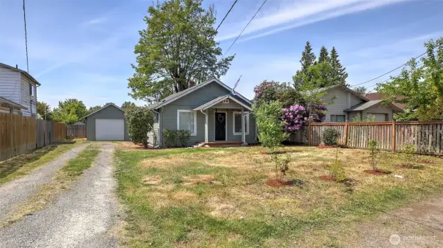 A long gravel driveway welcomes you home with plenty of space for parking, privacy, and easy access