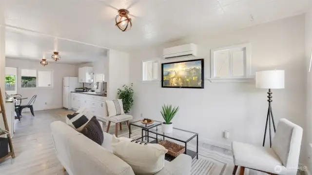 Step into an inviting open-concept living room—perfect for relaxing, entertaining, and everyday living