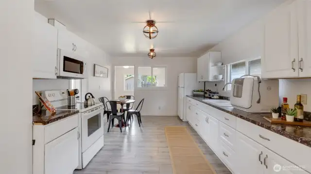 This spacious, open kitchen offers plenty of cabinet space for all your storage needs!
