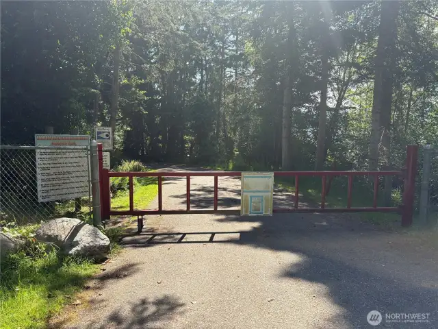This is the community keyed gate to get to the private community beach.  The community rules are posted on the sign to the left.  It's a gorgeous walk or drive to the beach - feels like a park!
