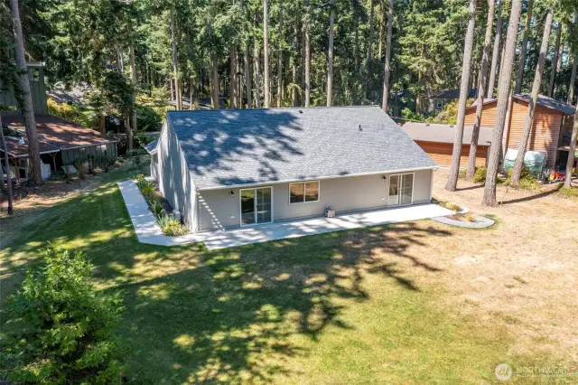 This property has a combination of grassy lawn and mature trees.
