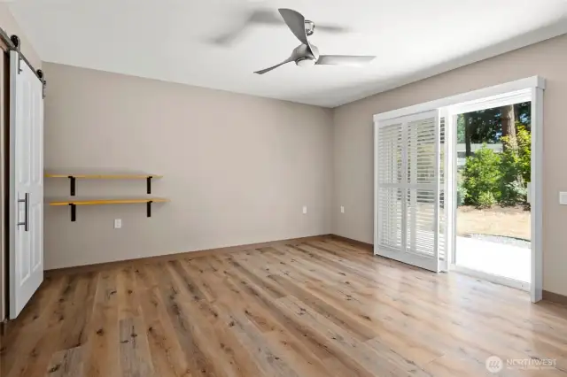 Lovely sliding barn door leads to the spacious en suite.