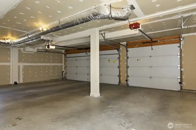 Three car garage with alley access.
