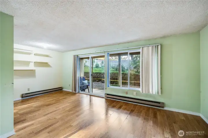 The dining room and living room together create a large space, offering many options for furniture layout and entertaining.