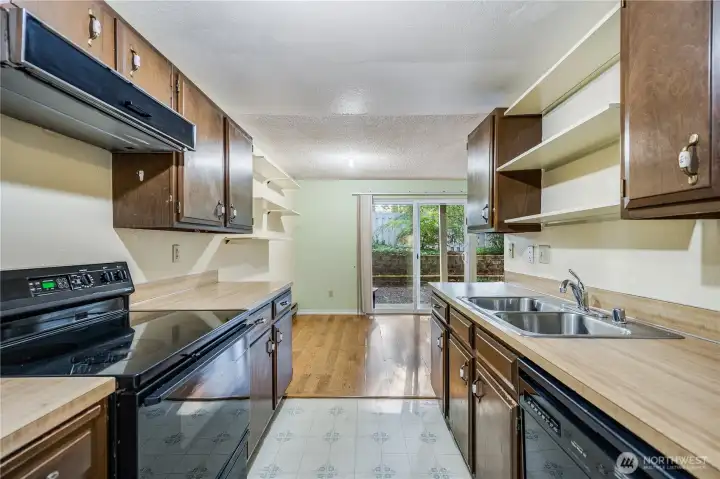The kitchen of the home has a view of the lovely view outside. It features ample counterspace for the home chef!