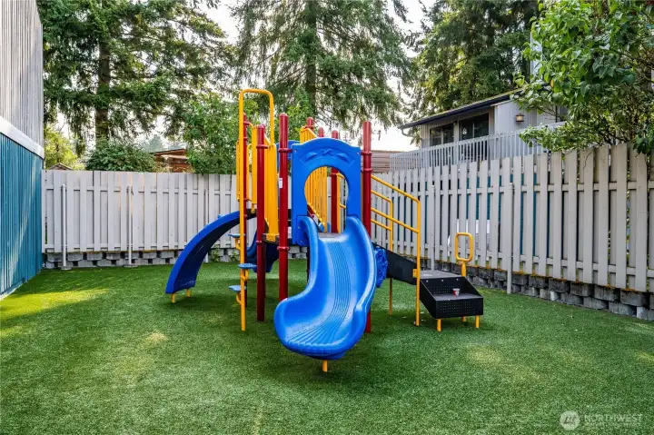 There is also a playground for the condo residents, over low-maintenance artificial grass.