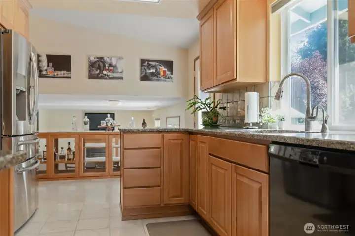 The well appointed kitchen is perfectly positioned to overlook the backyard and open to the rec room below. Ideal for entertaining, it lets you stay connected with guests while preparing food or refilling snacks, keeping everyone part of the fun.