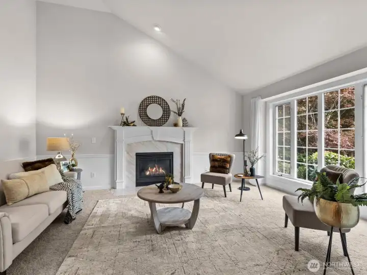 Immediately to your right is the formal living room with cozy gas fireplace.