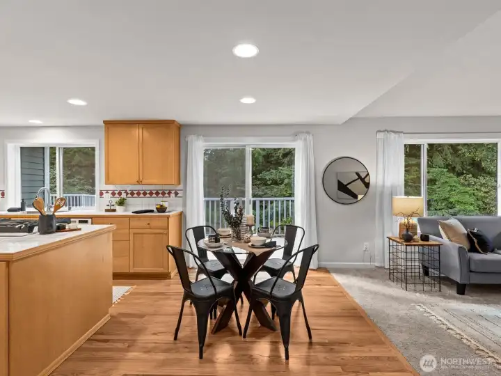 An informal dining space compliments the area and provides access to the deck. Perfect for entertaining!