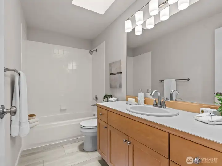 Next door is the hall bathroom.