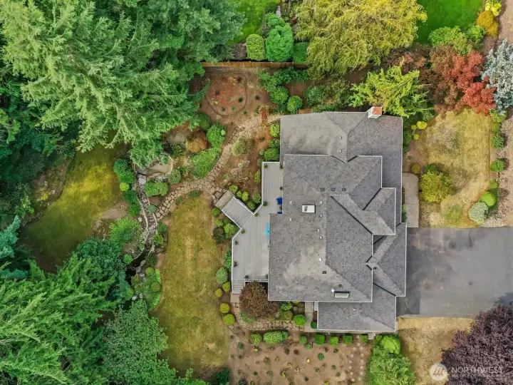 Enjoy the soothing sound of the water feature as it trickles through the middle of the yard.