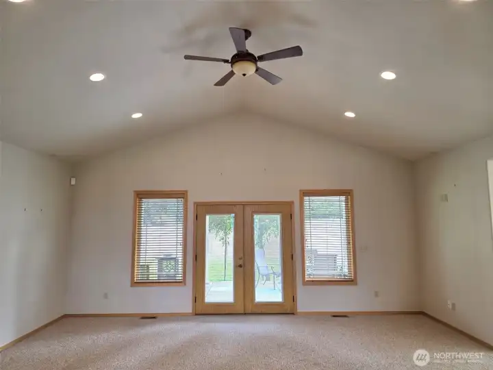 Open concept great room with Vaulted ceilings.  Walk out to covered patio.