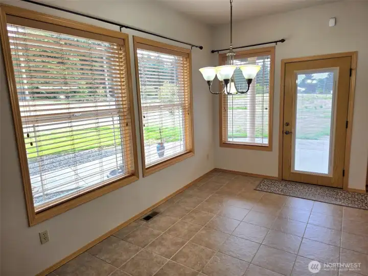 Eat in area off kitchen.  Wood wrapped windows.  Window blinds