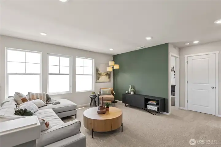 Large loft area perfect for media space, game room, or playroom. Actual home is under construction and finishes, materials, and colors will vary. See site agent for details.