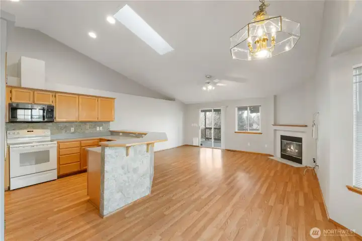 Vaulted ceilings give off a grand feeling in family room & kitchen