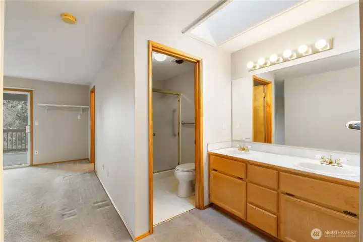 Within primary bedroom 2 vanity sink and 3/4 bathroom.