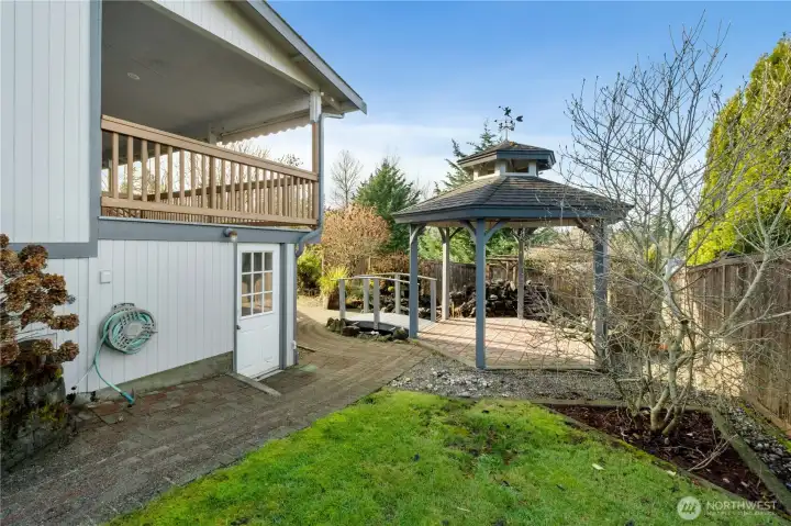 Side of house with entrance into garden room