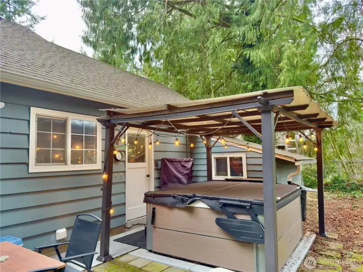 iIncluded hot tub. Door leads to laundry room and mudroom
