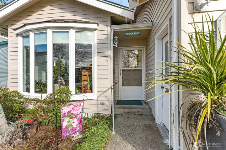 Entry and door to the left is to the garage.  Flowerbeds will be in full bloom soon!