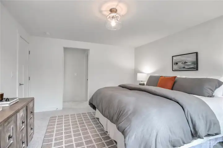 The primary bedroom features new plush carpet.