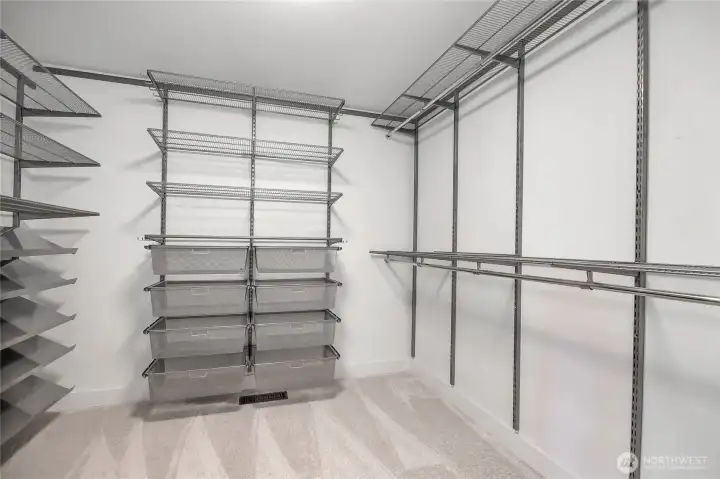 The primary bedroom closet features a practical built-in system.