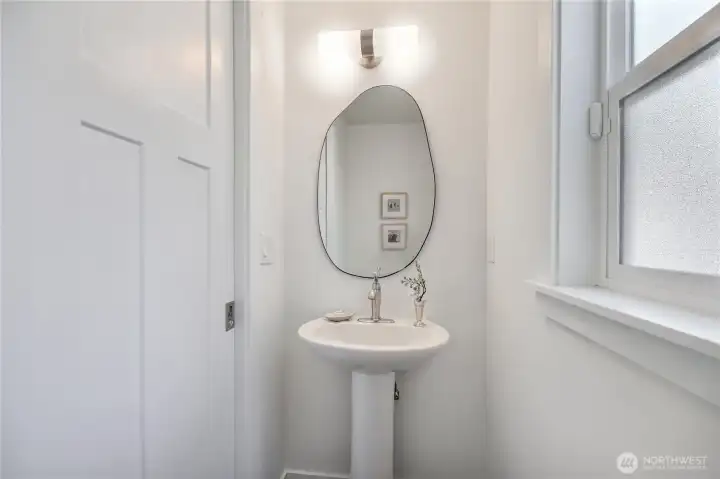The main level half bath is perfect for guests.