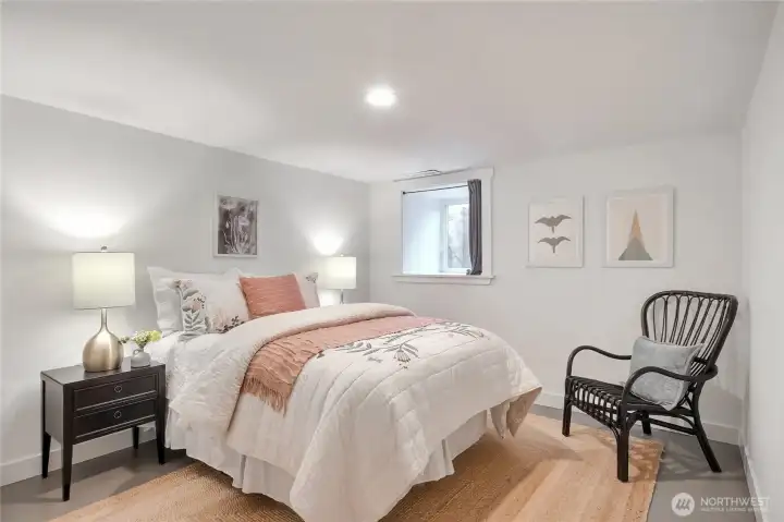 The lower level bedroom has a spacious closet and large window.