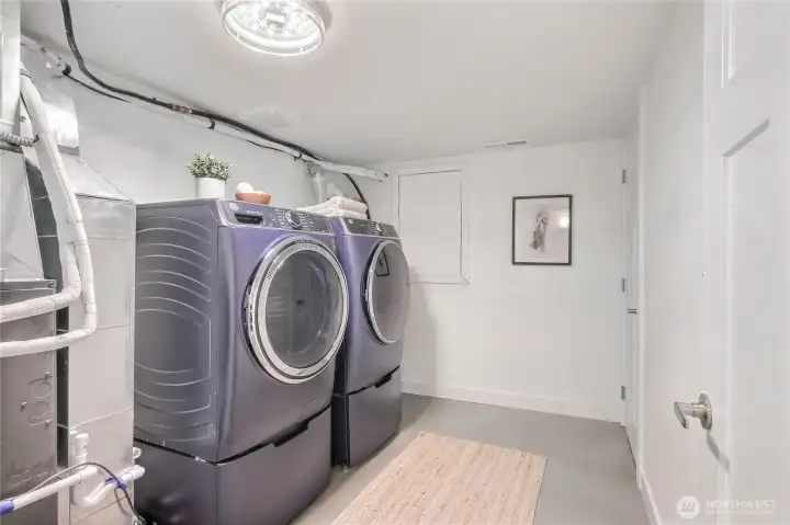 The laundry/utility room includes a new washer/dryer, new high efficiency heat pump w/ air conditioning and a new tankless water heater.