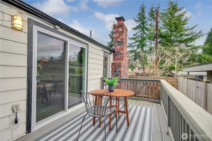 The deck off of the kitchen/dining room is a perfect place to enjoy the sun while sipping on your morning coffee.