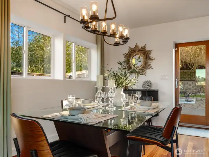 The dining experience is enhanced by the view of the private back yard.