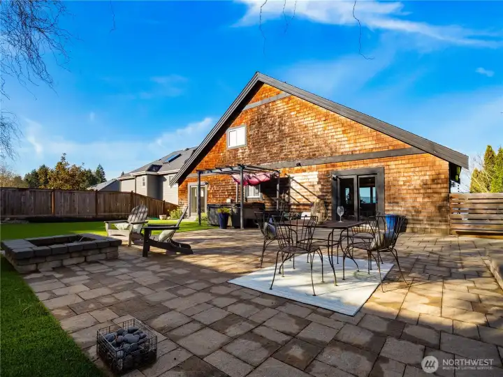 Look at this back yard. Privacy and room for a lot of different activities with its firepit, hot tub outdoor area or low-maintenance green space.