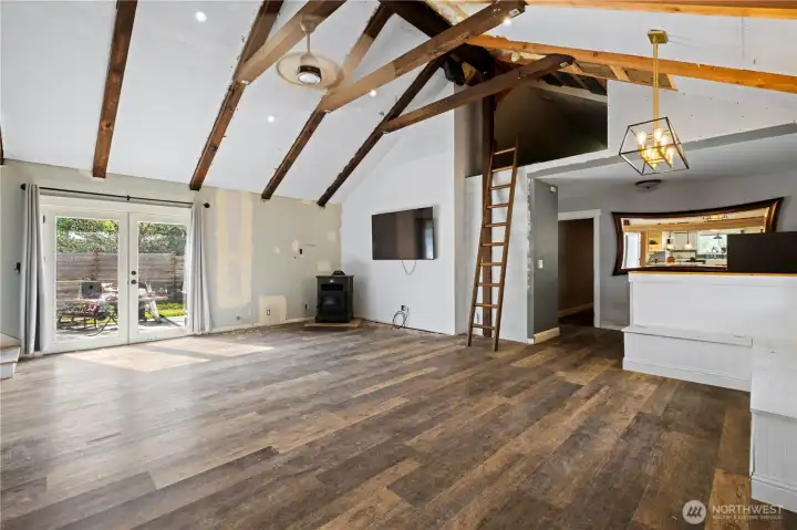Vaulted Ceilings with exposed Beams and French doors to the Patio