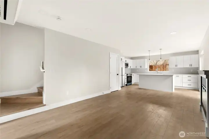 Expansive open living space with 8' ceilings, luxury wide-plank flooring, LED lighting and mini-split HVAC for year-round heating and cooling.