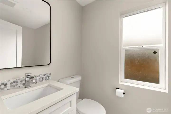 Main floor powder room and laundry.