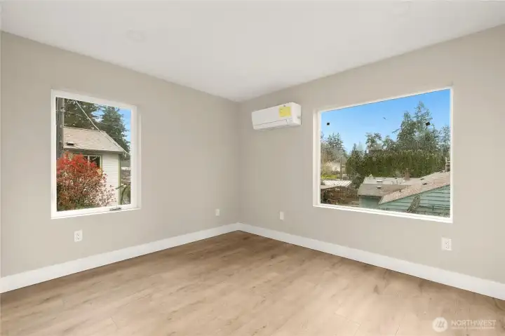 Upper level 2nd suite with mini-split heating/cooling, expansive windows and LED lighting.