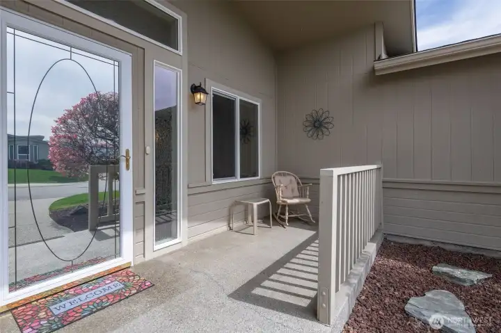 Entry features a no-slip aggregate porch and upscale storm door.