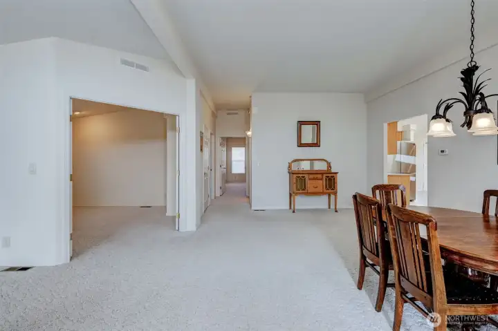 The den/office is on the left (double door entry) & bedrooms are down the hallway.