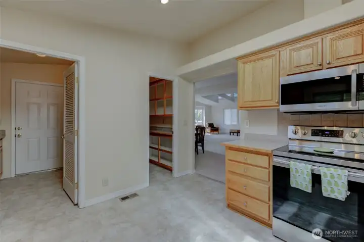 This well-appointed kitchen ALSO boasts a deep walk-in pantry and easy access to the garage.