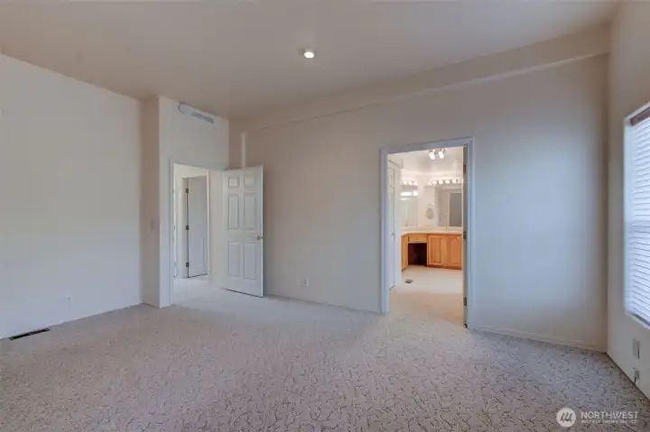 Primary suite is large enough to accommodate any combination of furniture and offers a large walk-in closet (not shown) as well as an oversized attached bathroom.